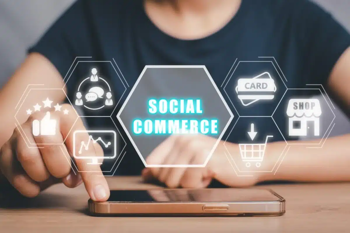Person using smartphone with augmented reality icons displaying Social Commerce and shopping elements floating around.