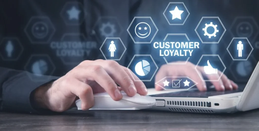 Person analysing digital customer loyalty graphics on a laptop, with augmented reality icons in the foreground.